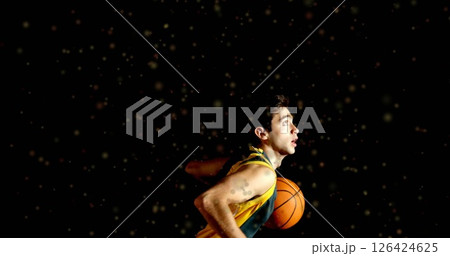 Image of moving spots over biracial male basketball player playing basketball 126424625