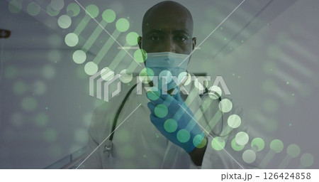 Image of dna strands over biracial male doctor with face masks 126424858