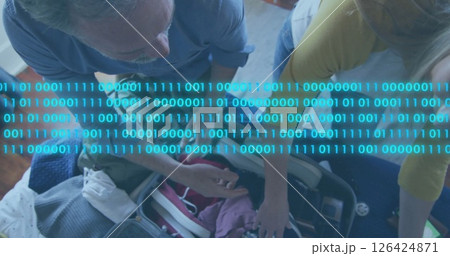 Binary code image over people packing suitcase Binary code image over people packing suitcase 126424871