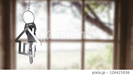 House-shaped keychain and keys image over blurred window background House-shaped keychain and keys image over blurred window background 126425036