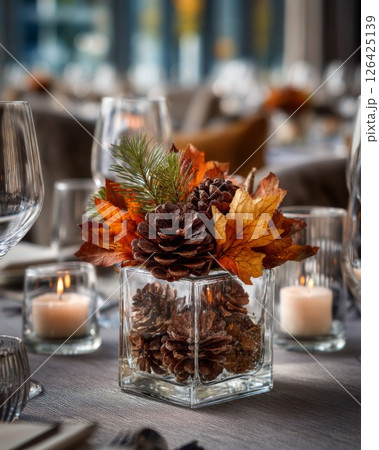 Autumnal Centerpiece with Pine Cones and Leaves 126425139
