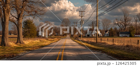 Autumn Country Road with Golden Hour Sunlight 126425305