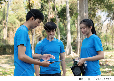 Sustainable volunteering. Youths collaborating for environmental cleanup. Sustainable volunteering. Youths collaborating for environmental cleanup. 126425667