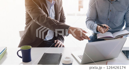 Asian business adviser meeting to analyze and discuss the situation on the financial report in the meeting room.Investment Consultant,Financial advisor and accounting concept 126426174