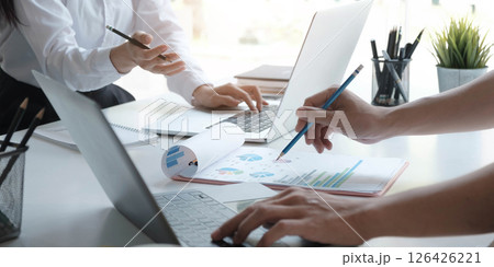 Close up Business people meeting to discuss the situation on the market. Business Financial Concept Close up Business people meeting to discuss the situation on the market. Business Financial Concept 126426221