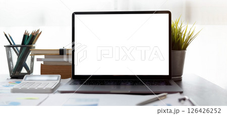 Blank screen Laptop computer and poster workspace background in modern office 126426252