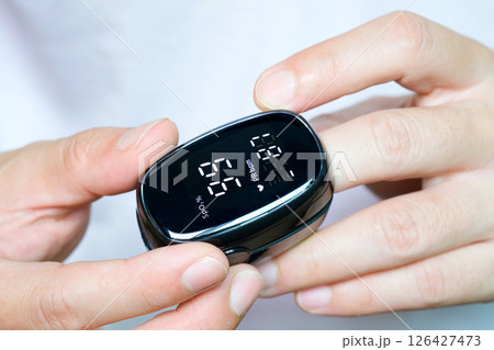 A device to measure the oxygen saturation of a person at the fingertips. And checking oxygen depletion is an emergency sign of pneumonia caused by the COVID-19 virus. A device to measure the oxygen saturation of a person at the fingertips. And checking oxygen depletion is an emergency sign of pneumonia caused by the COVID-19 virus. 126427473