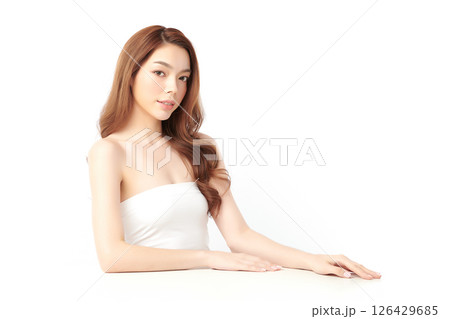 A beautiful young Asian woman with clean, fresh skin against a white background. Skincare, facial treatment, cosmetology, beauty, and spa. An elegant portrait of an Asian woman. A beautiful young Asian woman with clean, fresh skin against a white background. Skincare, facial treatment, cosmetology, beauty, and spa. An elegant portrait of an Asian woman. 126429685