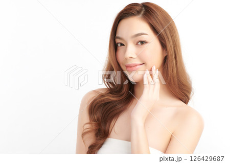 A beautiful young Asian woman with clean, fresh skin against a white background. Skincare, facial treatment, cosmetology, beauty, and spa. An elegant portrait of an Asian woman. A beautiful young Asian woman with clean, fresh skin against a white background. Skincare, facial treatment, cosmetology, beauty, and spa. An elegant portrait of an Asian woman. 126429687