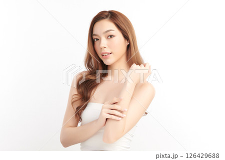 A beautiful young Asian woman with clean, fresh skin against a white background. Skincare, facial treatment, cosmetology, beauty, and spa. An elegant portrait of an Asian woman. A beautiful young Asian woman with clean, fresh skin against a white background. Skincare, facial treatment, cosmetology, beauty, and spa. An elegant portrait of an Asian woman. 126429688