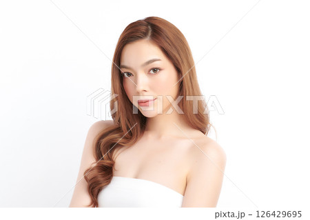 A beautiful young Asian woman with clean, fresh skin against a white background. Skincare, facial treatment, cosmetology, beauty, and spa. An elegant portrait of an Asian woman. A beautiful young Asian woman with clean, fresh skin against a white background. Skincare, facial treatment, cosmetology, beauty, and spa. An elegant portrait of an Asian woman. 126429695