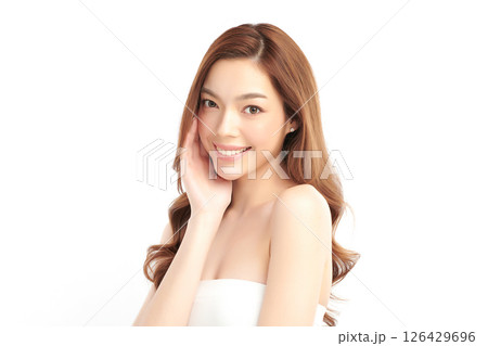 A beautiful young Asian woman with clean, fresh skin against a white background. Skincare, facial treatment, cosmetology, beauty, and spa. An elegant portrait of an Asian woman. A beautiful young Asian woman with clean, fresh skin against a white background. Skincare, facial treatment, cosmetology, beauty, and spa. An elegant portrait of an Asian woman. 126429696