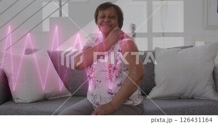 Image of cardiograph over senior biracial woman with patch on arm 126431164