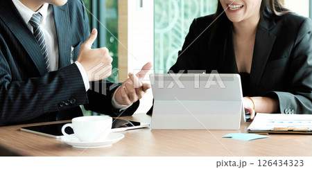 Fund managers team consultation and discuss about analysis Investment stock market by digital tablet. Fund managers team consultation and discuss about analysis Investment stock market by digital tablet. 126434323