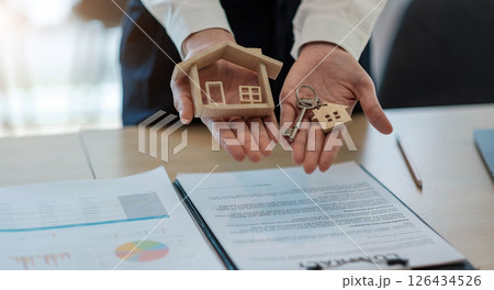 House model and key on table for finance and banking concept.Home purchase mortgage concept. House model and key on table for finance and banking concept.Home purchase mortgage concept. 126434526