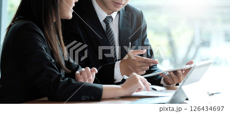 Fund managers team consultation and discuss about analysis Investment stock market by digital tablet. Fund managers team consultation and discuss about analysis Investment stock market by digital tablet. 126434697