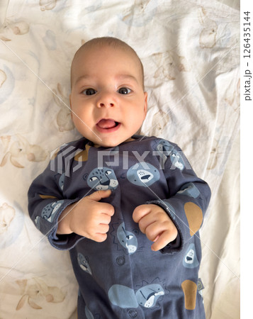 Baby in Blue Onesie with Animal Prints Baby in Blue Onesie with Animal Prints 126435144