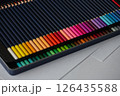 Set of two rows of colored pencils in a pencil case 126435588