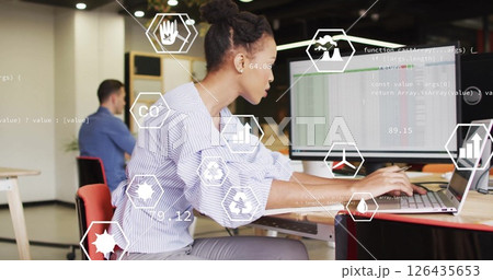 Image of media icons and data processing over diverse colleagues working in office 126435653