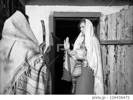 Girl in the door of her home 126436472