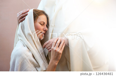 Jesus hugging a praying woman Jesus hugging a praying woman 126436481