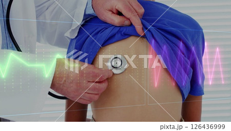 Image of cardiographs over caucasian male doctor examining patient Image of cardiographs over caucasian male doctor examining patient 126436999