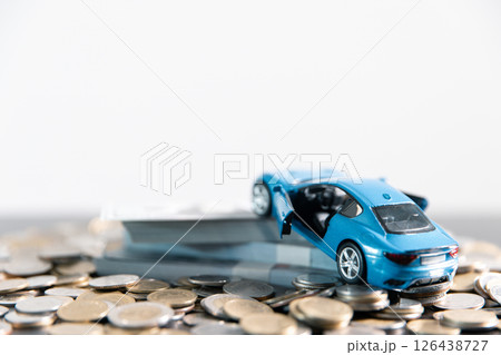 Securing loan for car involves understanding finance options, insurance requirements and overall cost, making it crucial business concept in auto industry impacts final price and money management. 126438727