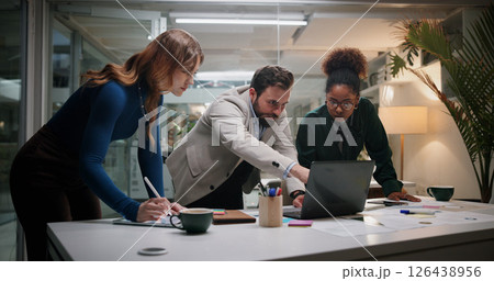 Leader, project and business people on laptop for planning, collaboration and investment news. Manager, night and financial advisor pointing in meeting for teamwork, accounting or risk management Leader, project and business people on laptop for planning, collaboration and investment news. Manager, night and financial advisor pointing in meeting for teamwork, accounting or risk management 126438956