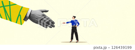Large hand in yellow sleeve reaches out to woman in blue shirt for handshake. Deal. 126439199