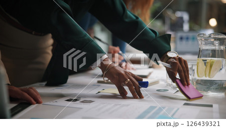 Night, business and hands of people with paperwork for planning, campaign management and agenda in office. Company team, workshop and sticky notes in workplace with documents, meeting and late tasks 126439321
