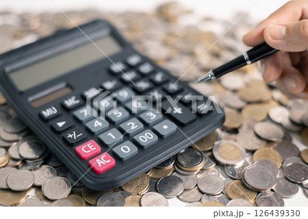 Effective finance management involves strategic investment and saving practices to foster growth in money, with careful accounting of coins and currency essential for a thriving business and economy. 126439330