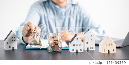 Real estate agent helped the client secure a mortgage loan for their property investment, ensuring the contract was properly handled by the broker. investment, property, estate, loan, real, mortgage. 126439339