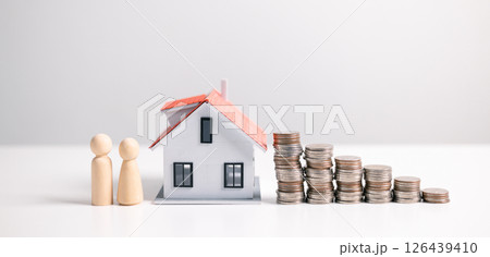 Investment in a home often involves securing a mortgage loan, with a finance agent helping to manage business and property aspects of the house to ensure best use of your money. investment, loan. 126439410