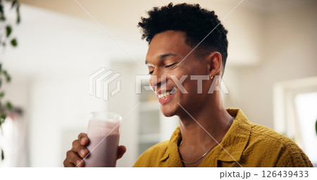 Man, happy and smoothie in kitchen for detox, healthy diet or meal replacement recipe for wellness. Nutritionist, smile or drink in home for gut health, vitamin boost or fresh fruit in protein shake Man, happy and smoothie in kitchen for detox, healthy diet or meal replacement recipe for wellness. Nutritionist, smile or drink in home for gut health, vitamin boost or fresh fruit in protein shake 126439433