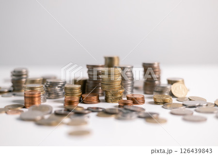 Stack of coins symbolizes core principles of finance, from saving and investment to business and banking, reflecting vital role currency plays in economy and management of money. finance, investment. Stack of coins symbolizes core principles of finance, from saving and investment to business and banking, reflecting vital role currency plays in economy and management of money. finance, investment. 126439843