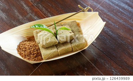 Mochi warabi mochi on a wooden table. Mochi warabi mochi on a wooden table. 126439989
