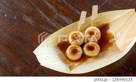 Two Dango on a wooden table. Two Dango on a wooden table. 126440121