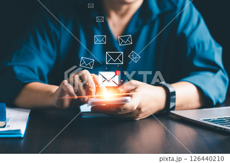 Businesses send electronic mail and newsletters to clients as part of their online marketing strategy, delivering messages through various platforms like social media and phone. electronic mail. 126440210