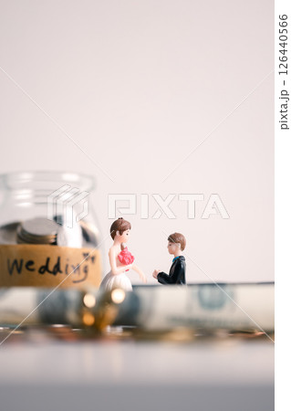 Woman carefully manages her wedding fund, making payments from her bank account and using credit wisely, with the background of sound financial plan supporting her marriage and business commitments. Woman carefully manages her wedding fund, making payments from her bank account and using credit wisely, with the background of sound financial plan supporting her marriage and business commitments. 126440566