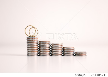 Woman carefully manages her wedding fund, making payments from her bank account and using credit wisely, with the background of sound financial plan supporting her marriage and business commitments. Woman carefully manages her wedding fund, making payments from her bank account and using credit wisely, with the background of sound financial plan supporting her marriage and business commitments. 126440571