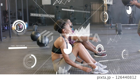 Image of diagrams and data processing over diverse couple exercising at gym Image of diagrams and data processing over diverse couple exercising at gym 126440812