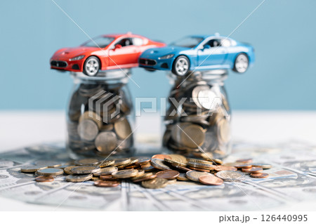 Buy a car, save money and consider the total fiscal value, market worth, and insurance costs. car, money, save, insurance, buy, fiscal, worth, market, total, value, concept. 126440995