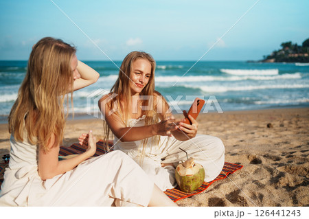 Group of Friends Taking Selfies and Smiling on a Beautiful Beach 126441243