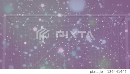 Image of glowing pink, blue and yellow light spots advancing on pink background 126441445