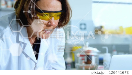 Image of data processing over caucasian female scientist in lab 126441678