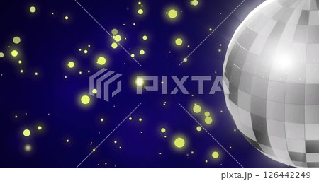 Image of yellow spots over disco ball 126442249