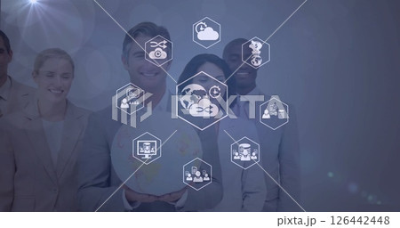 Image of media icons over diverse colleagues smiling with globe Image of media icons over diverse colleagues smiling with globe 126442448