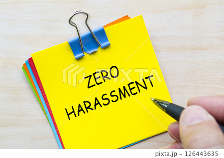 Zero harassment text on yellow sticky notes representing a no-tolerance policy towards abuse and misconduct Zero harassment text on yellow sticky notes representing a no-tolerance policy towards abuse and misconduct 126443635