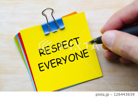 Respect everyone text on yellow sticky notes representing equality and kindness in daily interactions Respect everyone text on yellow sticky notes representing equality and kindness in daily interactions 126443639