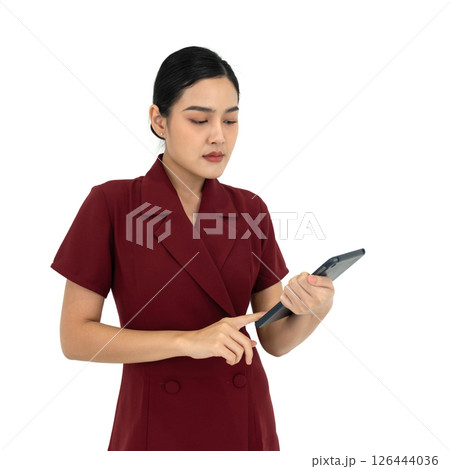 Young asian businesswoman in red dress typing on tablet computer. Portrait on white background with studio light. Isolated 126444036
